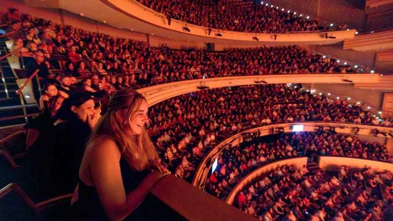 Audiences at the center, mezzanine, and balcony levels of the Overture.