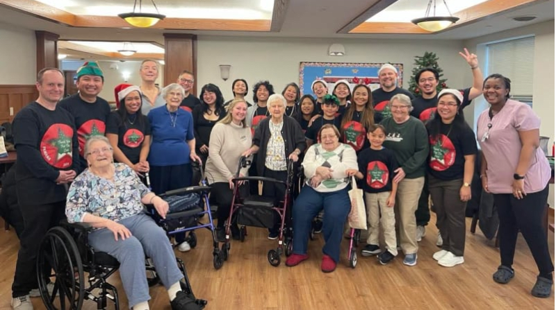 The PAMANA Carolers with Heritage Senior Living residents during the group's first performance for the 2025 on Dec. 6.