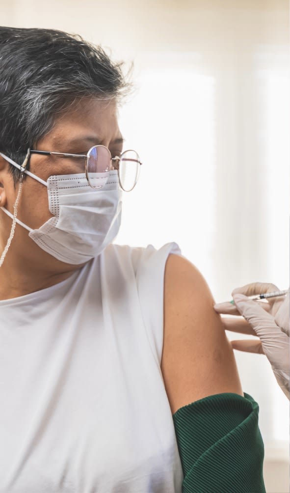 Senior getting vaccinated